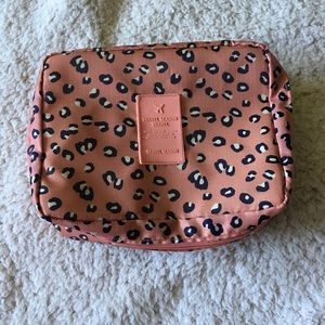 Pink, black and white makeup travel bag